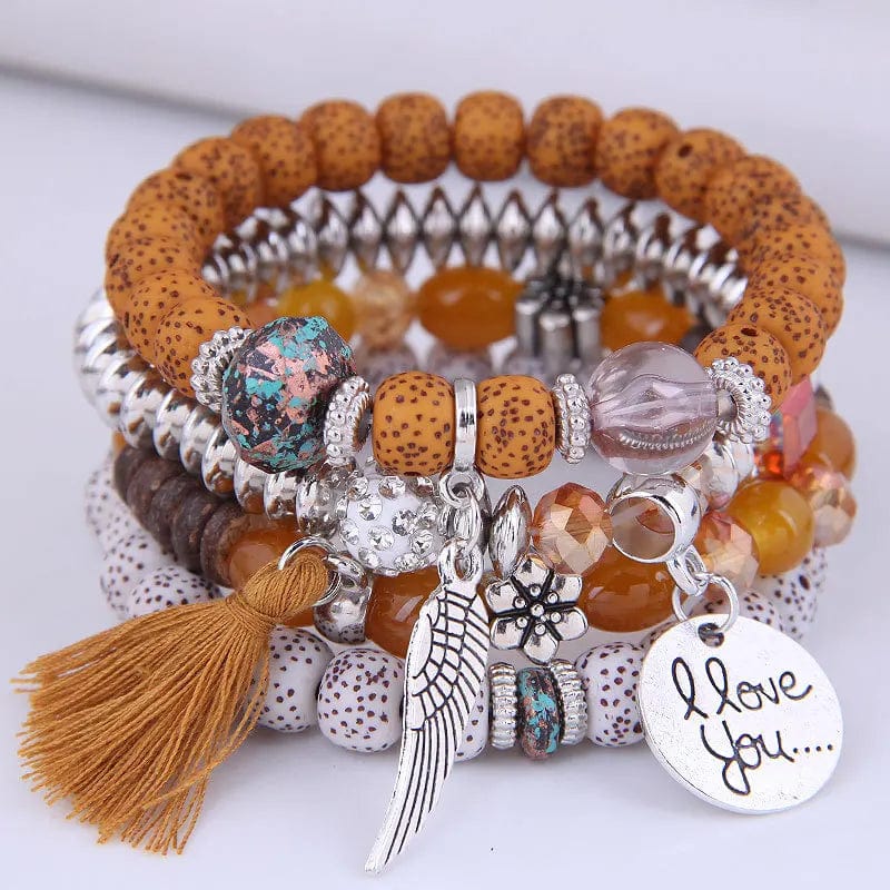Bohemian pink crystal bead bracelet for women with elastic tassel wing design and colorful rope accents.