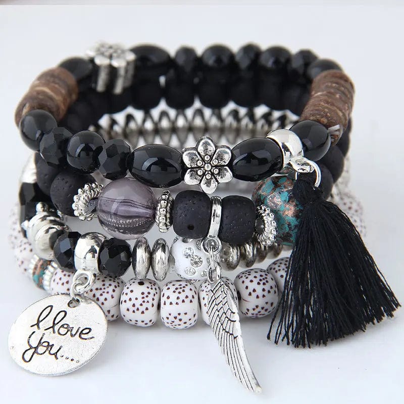Bohemian pink crystal bead bracelet with tassel wing for women, elastic design, stylish accessory for girls and women.