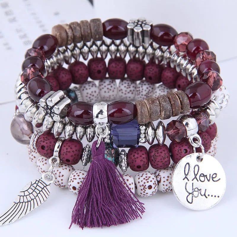 Bohemian pink crystal bead bracelet with tassel wing design for women, elastic fit, stylish and colorful accessory.