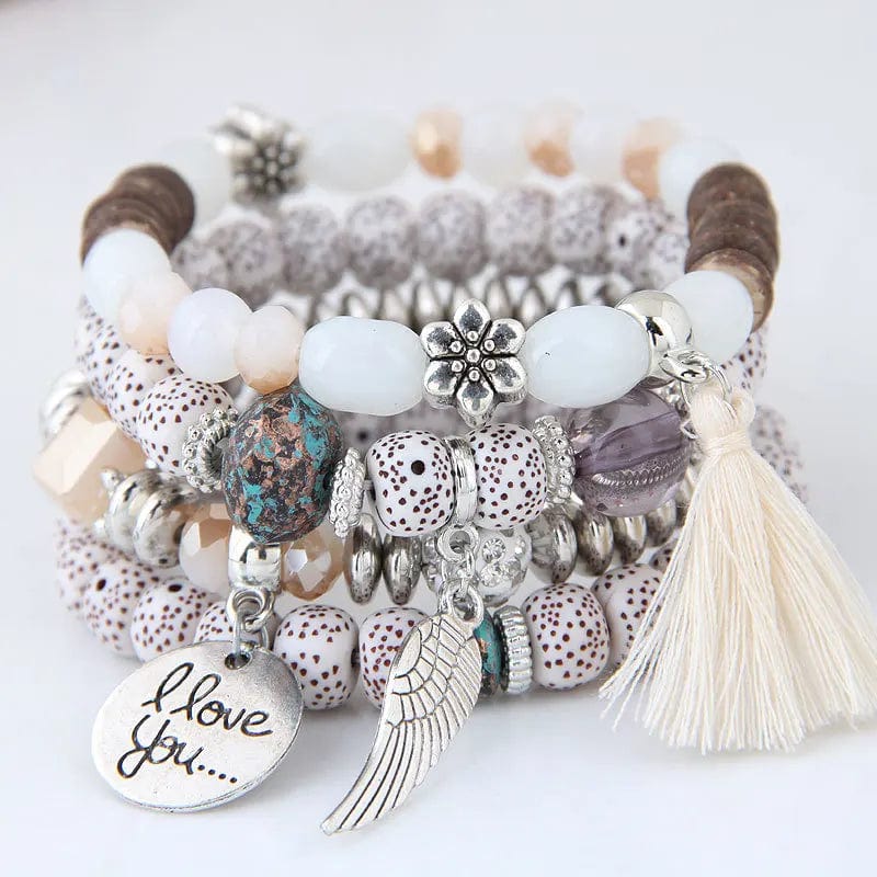 DIEZI Bohemian pink crystal bead bracelet with elastic tassel wing design for women and girls, featuring colorful beads and rope accents.