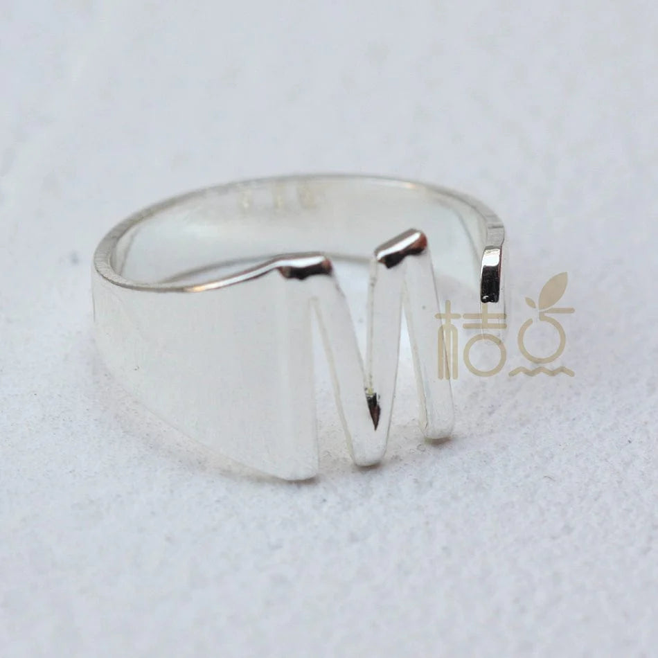 Silver plated open ring with customizable letter ornament, designed for finger wear and DIY jewelry creation