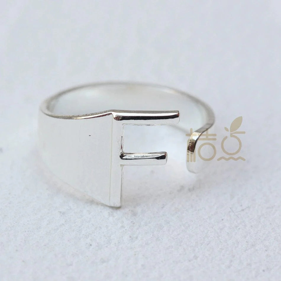 Silver plated open ring with customizable letter ornament, perfect for finger jewelry and DIY accessory projects.