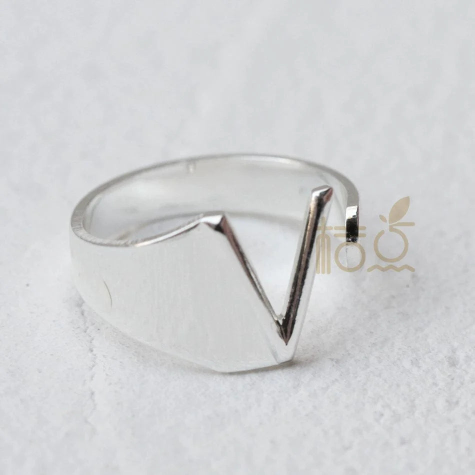 Silver plated open ring with customizable letter ornament, designed for finger wear and DIY jewelry creation.