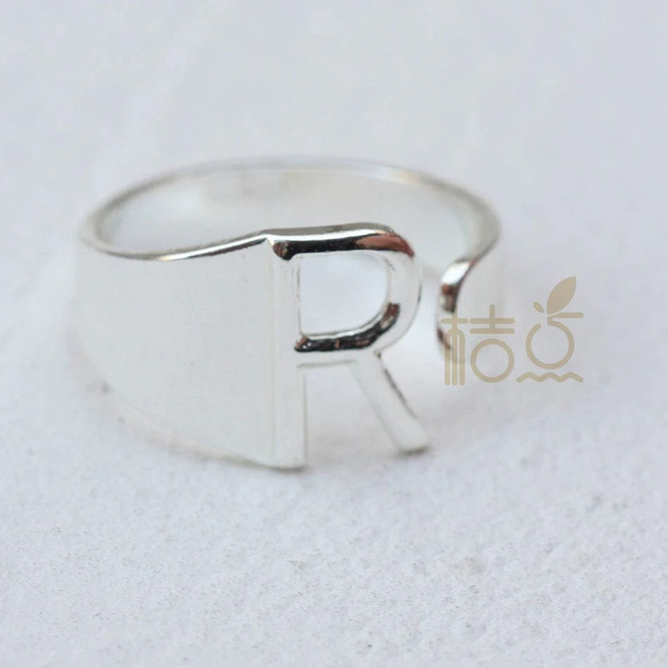Silver plated open ring with customizable letter ornaments, perfect for personalized DIY finger jewelry.