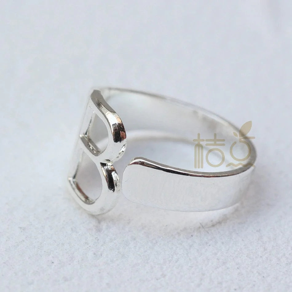 Silver plated open ring with customizable letter ornament, featuring a stylish and minimalist design for finger wear.