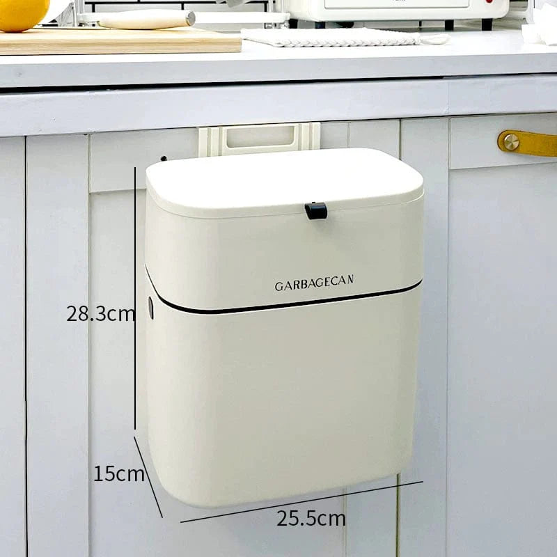 Wall-mounted Donha 4L plastic kitchen trash can by Showlu, hanging on cabinet door for convenient waste disposal.