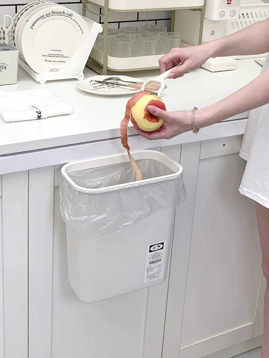 Donha wall-mounted kitchen trash can with 4L plastic hanging storage bucket, mounted on kitchen cabinet or wall.