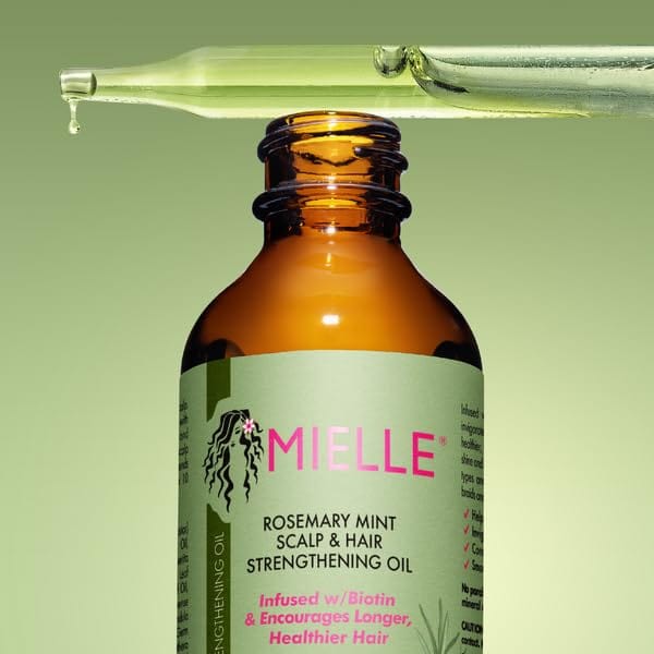 Mielle Organics Rosemary Mint Hair Strengthening Oil with Biotin in a 2oz bottle, designed for all hair types, shown in the image.