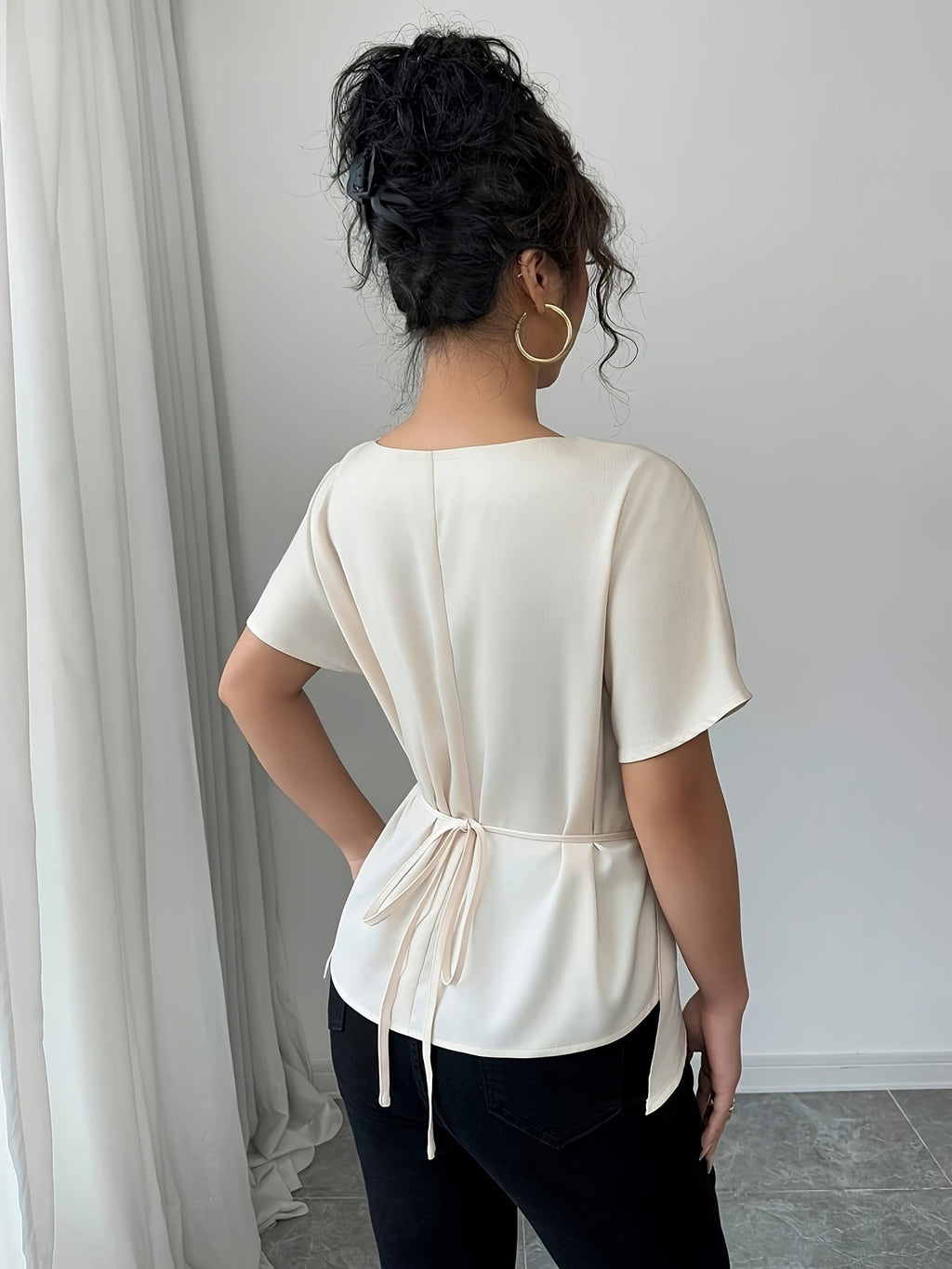 SHOWLU Women's off-shoulder blouse with asymmetrical hem and short sleeves, stylish fashion top for casual or dressy wear.