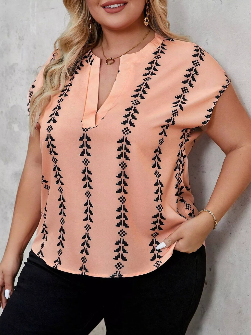 Plus size notched short sleeve blouse by Trendsi, featuring a stylish design with a notch neckline and comfortable fit.