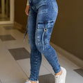Blue washed high waist skinny jeans for women from SHOWLU FASHION STORE, close-up of fitted denim pants showing details and texture.