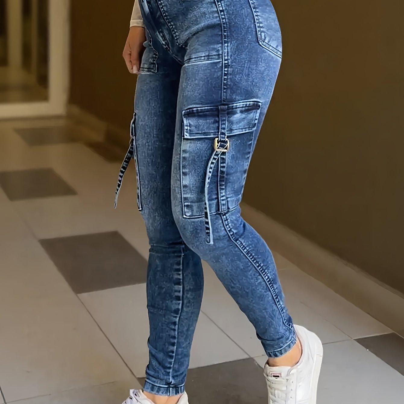 Blue washed high waist skinny jeans for women from SHOWLU FASHION STORE, close-up of fitted denim pants showing details and texture.