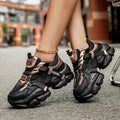 SHOWLU Women's black patchwork sneakers with breathable lace-up design and casual style, showcasing the stylish footwear.