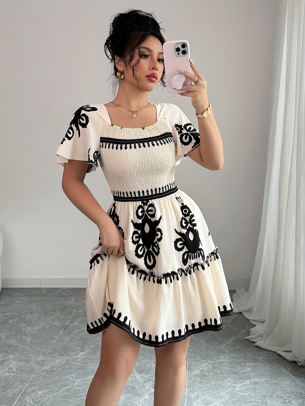Printed SHOWLU FASHION square neck mini dress with an A-line pleated style, displayed on a hanger.