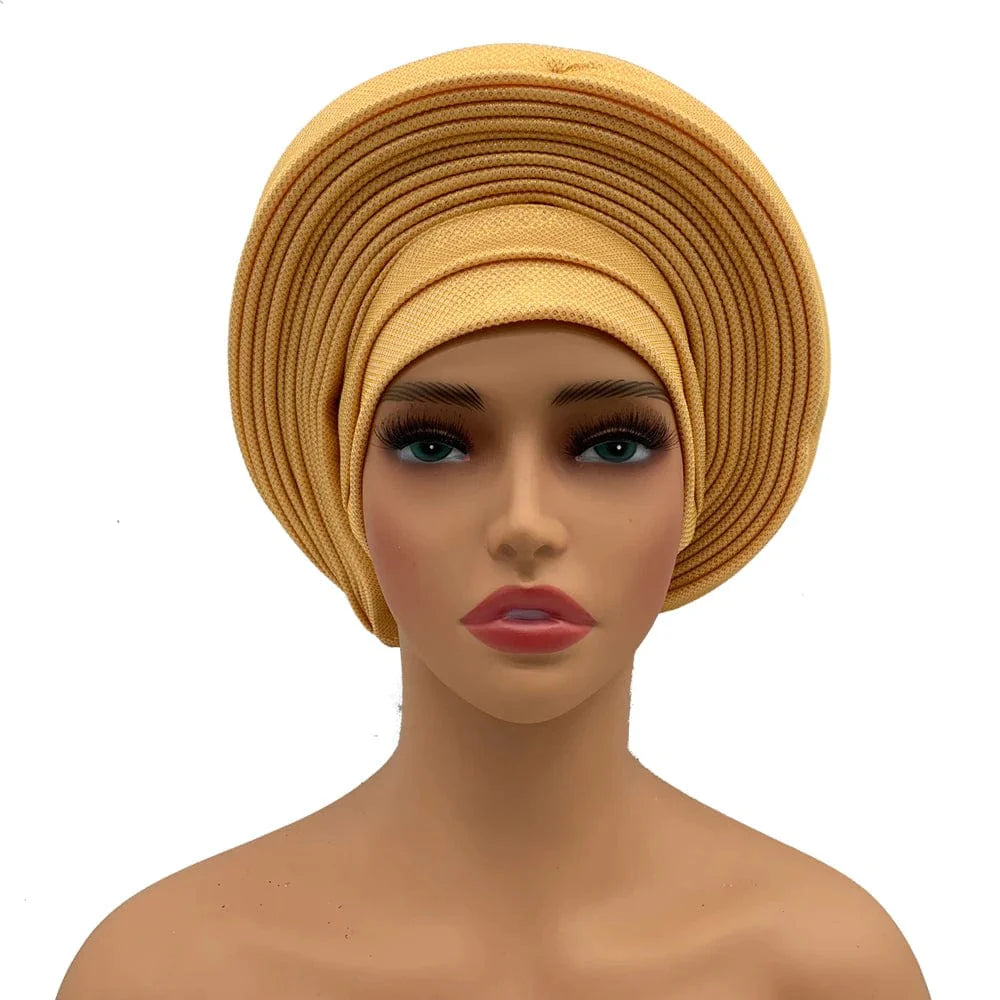 Elegant African auto gele headtie by Showlu Fashion, stylish women's turban head wrap for weddings and parties.