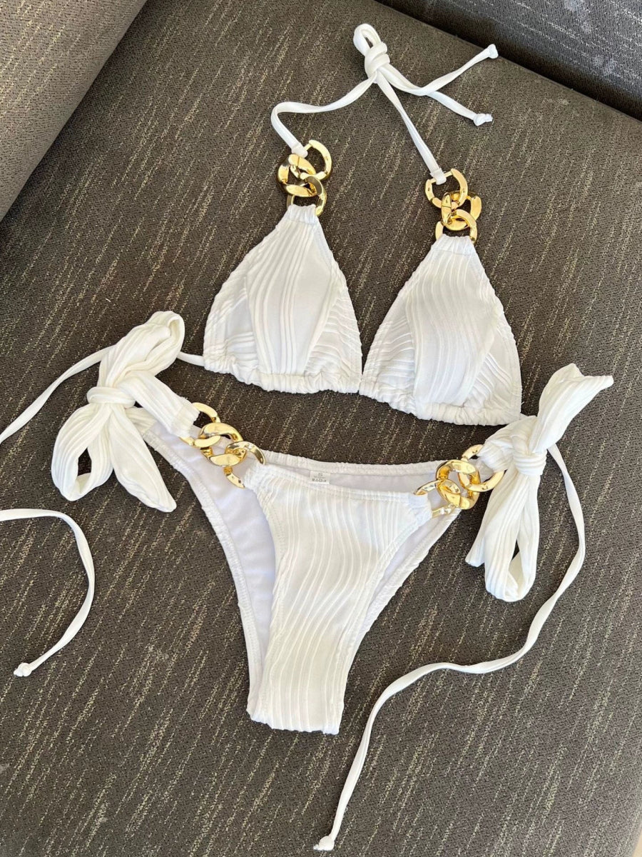 Elegant solid color triangle bikini with chain accents by Showlu Fashion, featuring sleek design and stylish chain-link details.