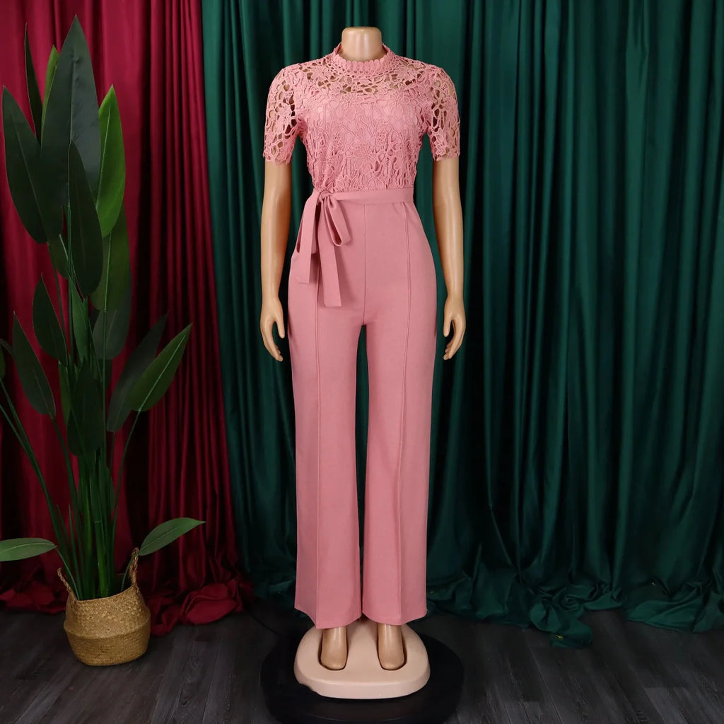 Elegant SHOWLU Women's lace patchwork jumpsuit with high waist, short sleeves, and sash for party or dinner events.