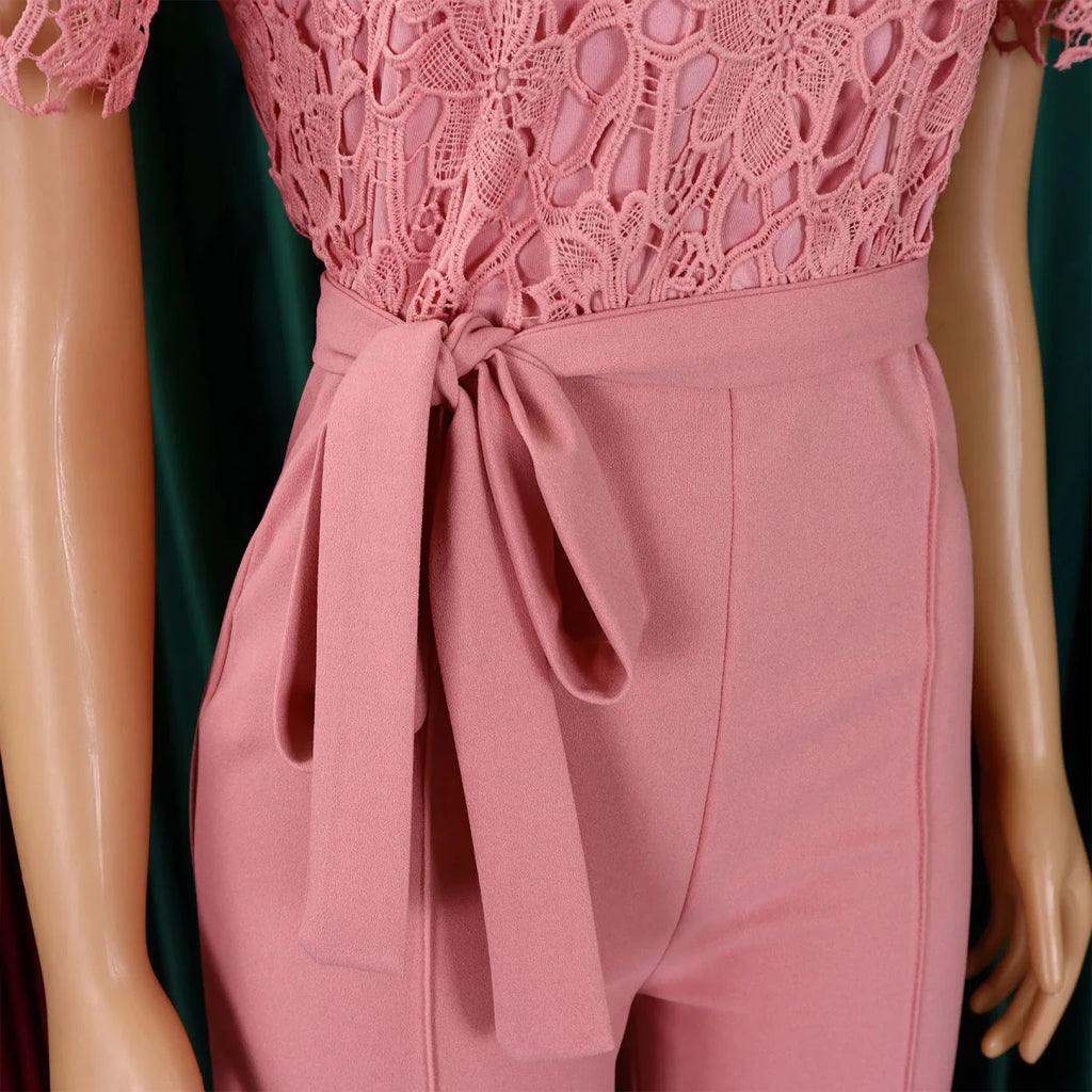Elegant SHOWLU Women's lace patchwork jumpsuit with high waist, short sleeves, and sash, ideal for parties or special occasions.