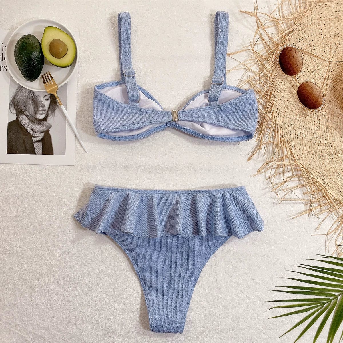 Elegant Showlu Fashion ruffled high-waist bikini two-piece swimsuit displayed on a model with a floral background.