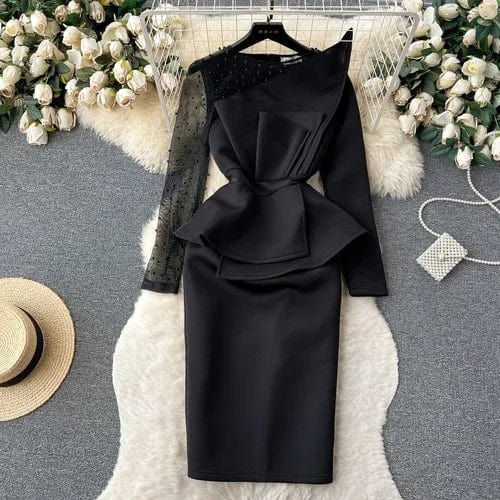 Elegant black mini dress with rhinestone patchwork, ruffle details, and long sleeves, perfect for party and special occasions.
