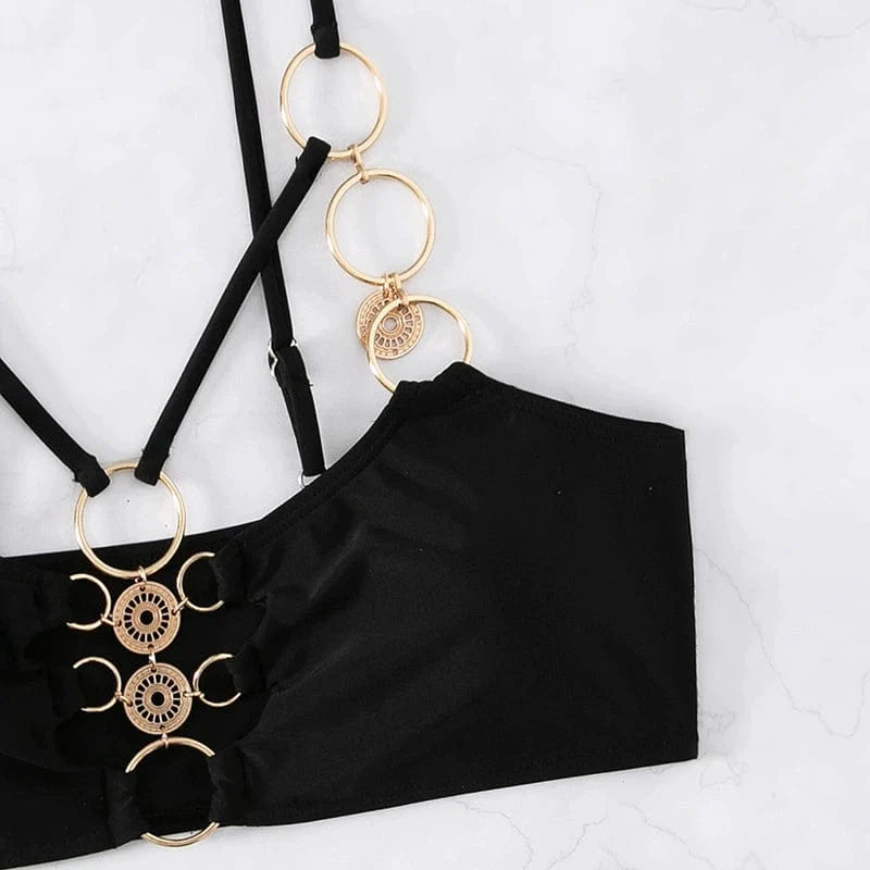 Elegant two-piece hollow metal ring bikini swimsuit for women by Showlu Fashion, featuring stylish design and metal ring accents.