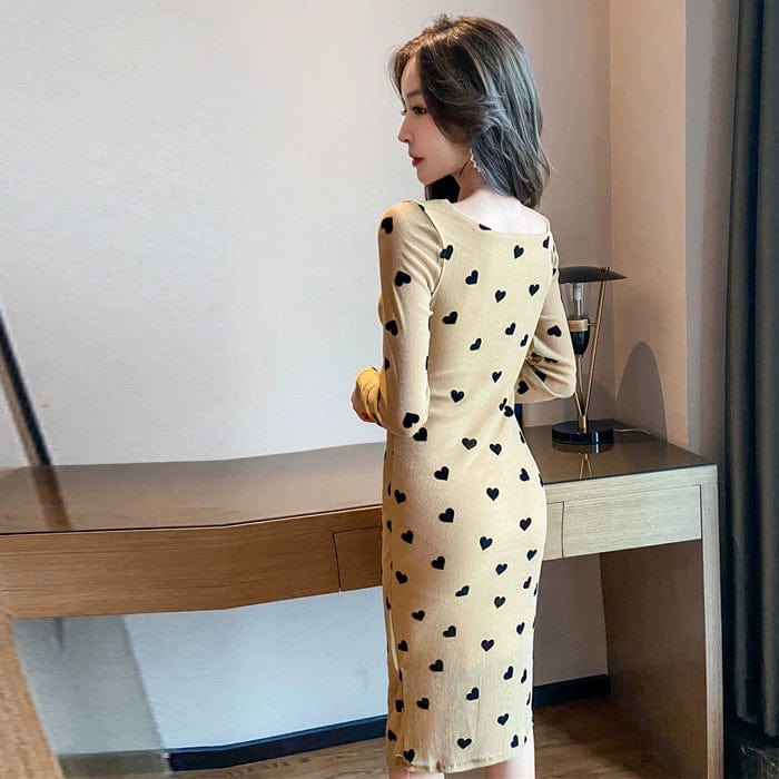 Showlu Fashion women's V-neck midi dress with long sleeves and heart print, featuring an elegant V-neck design.