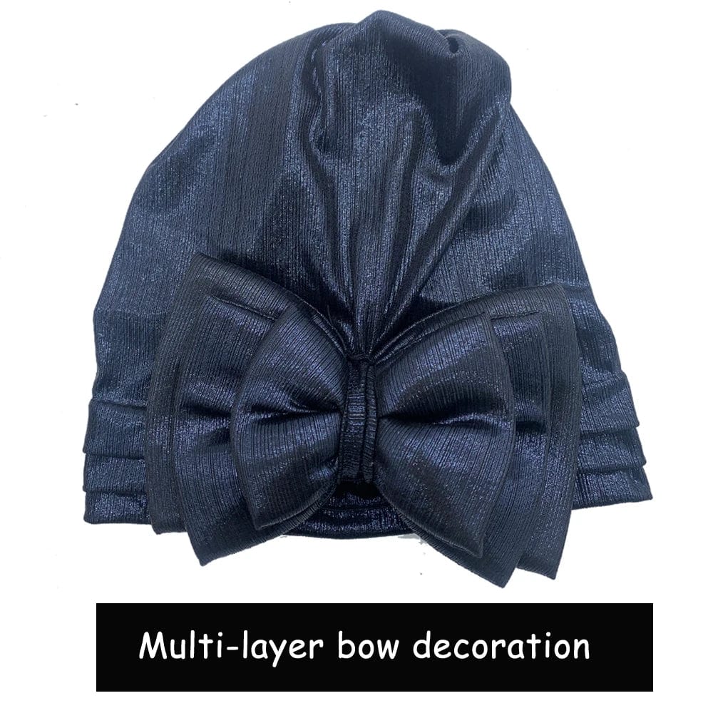 Elegant women's gold turban cap with multi-layer bowknot, African headtie, and headwrap, showcasing stylish headwrap fashion.