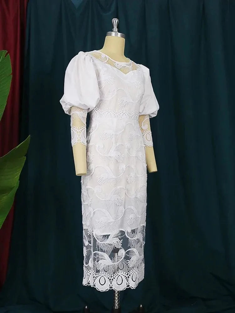 Elegant white lace embroidery pencil dress with puff sleeves, midi length, form-fitting sheath style, perfect for weddings or evening events.