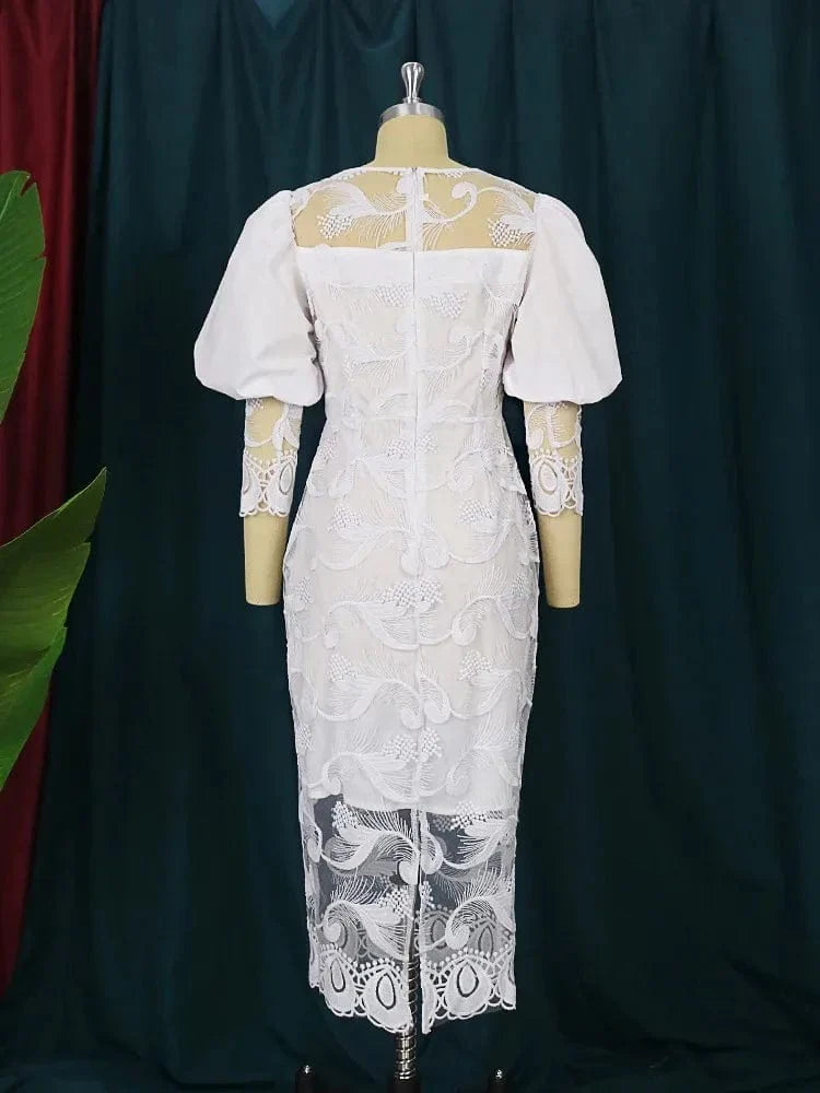Elegant white lace embroidery pencil dress with puff sleeves, midi length, form-fitting sheath style, suitable for special occasions.