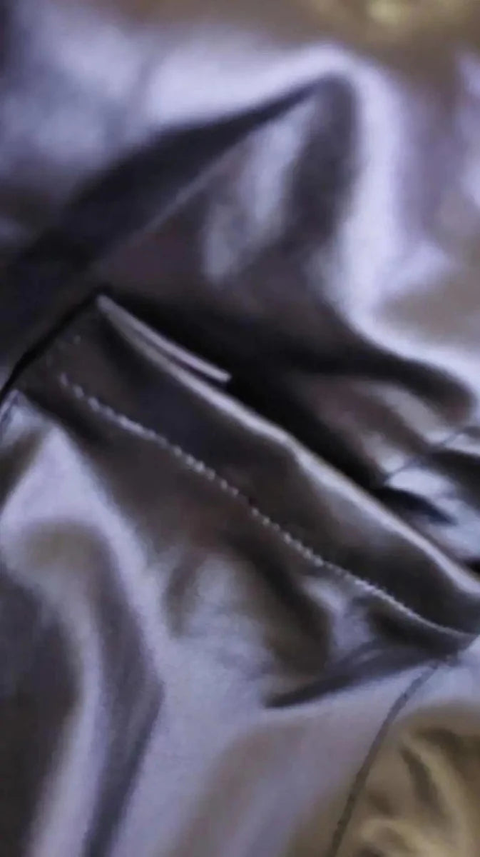 Elegant women's PU leather square neck skinny jumpsuit with shoulder straps, sleeveless design, buckle zipper, and a sexy bodycon fit.