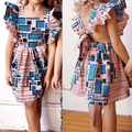 Girls wearing Showlu Fashion summer dress with flying sleeves, European style, featuring lightweight fabric and playful design.