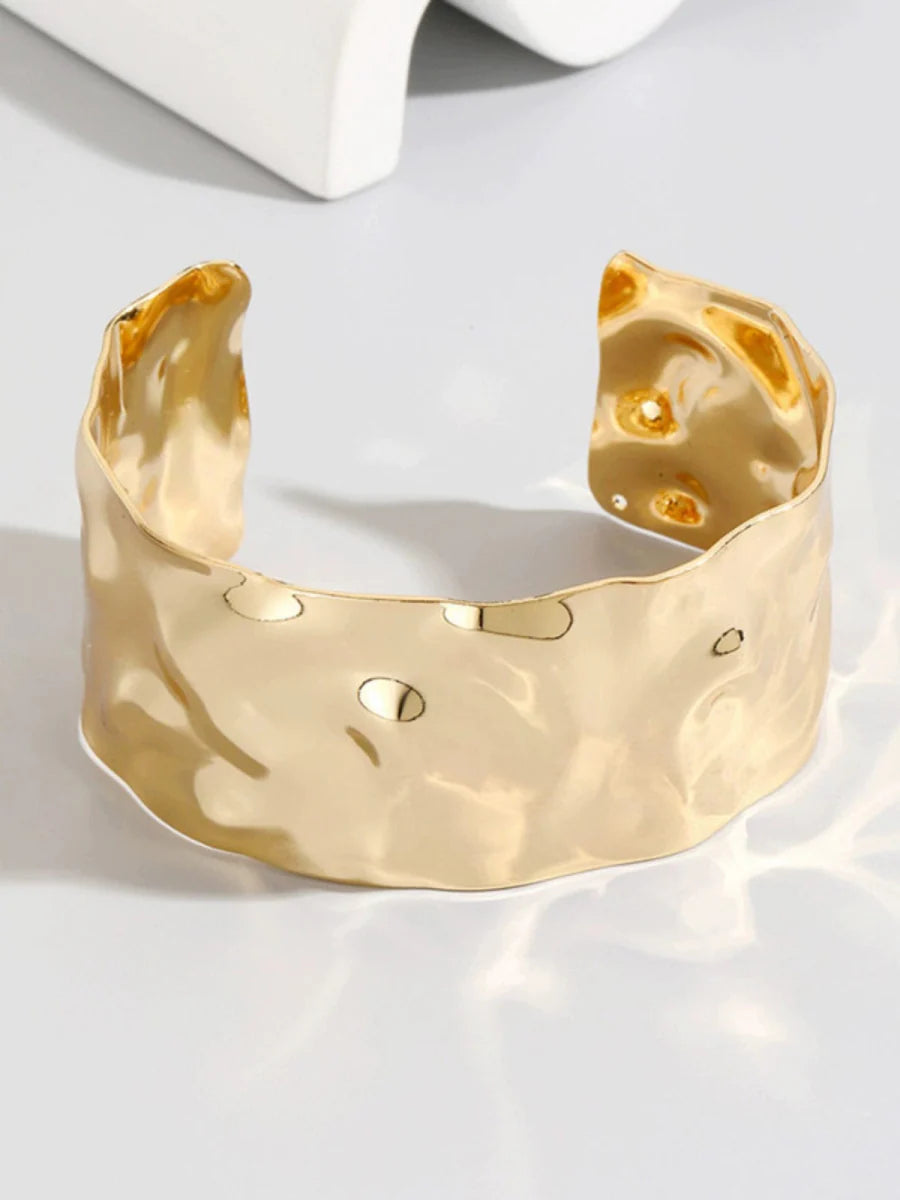Showlu Fashion open-ended bracelet for women with ruched metal texture, elegant retro-style jewelry accessory.