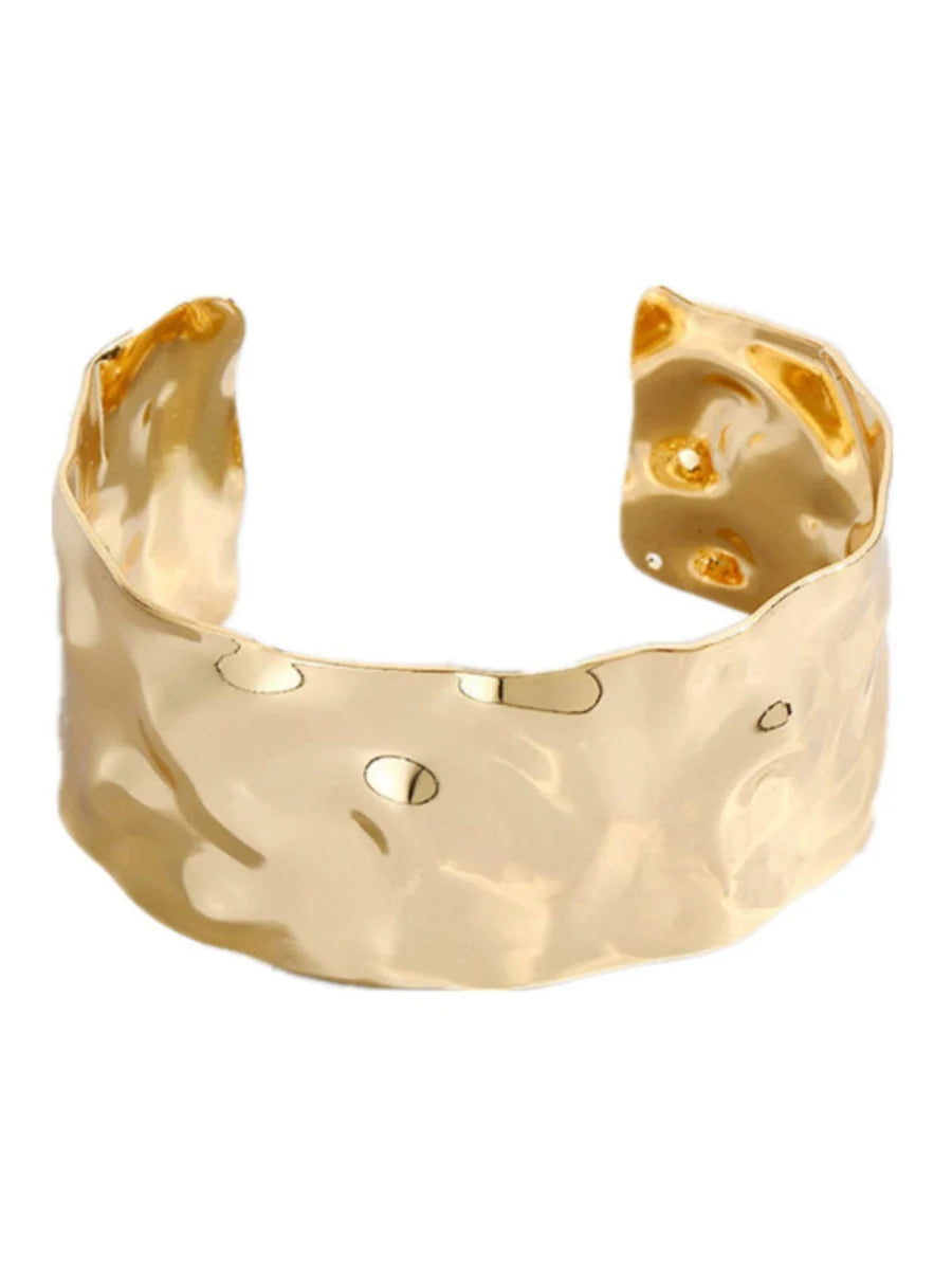 Elegant open-ended metal bracelet with ruched design, stylish for women, featuring a textured retro-inspired finish.