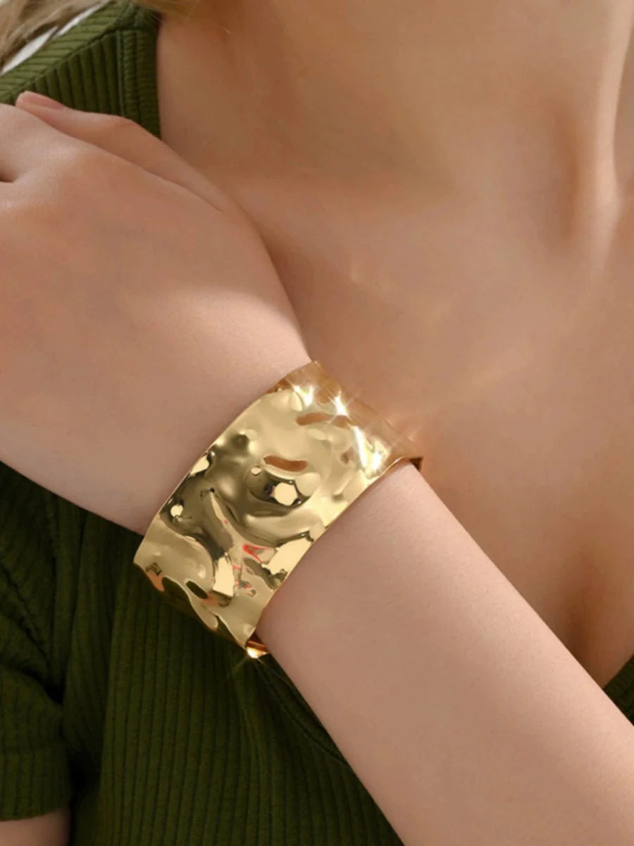 Elegant open-ended ruched metal bracelet for women featuring a textured, retro-style design and modern jewelry aesthetic.