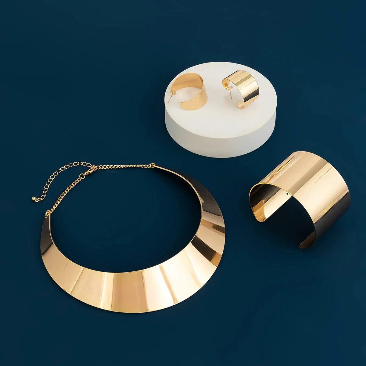African collar jewelry set by Showlu Fashion with wide smooth metal necklace, matching earrings, and bracelet for women.
