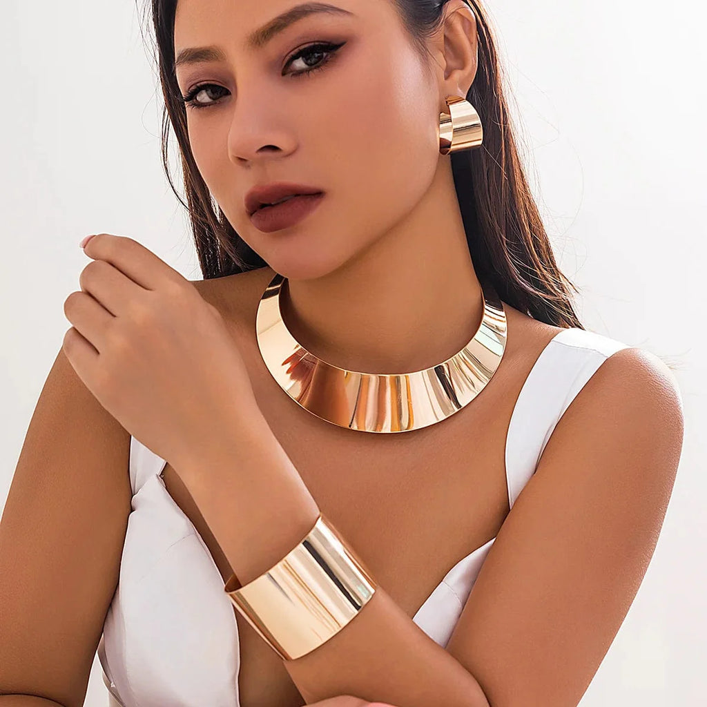 Showlu Fashion African collar jewelry set with wide smooth metal necklace, matching earrings, and bracelet for women.