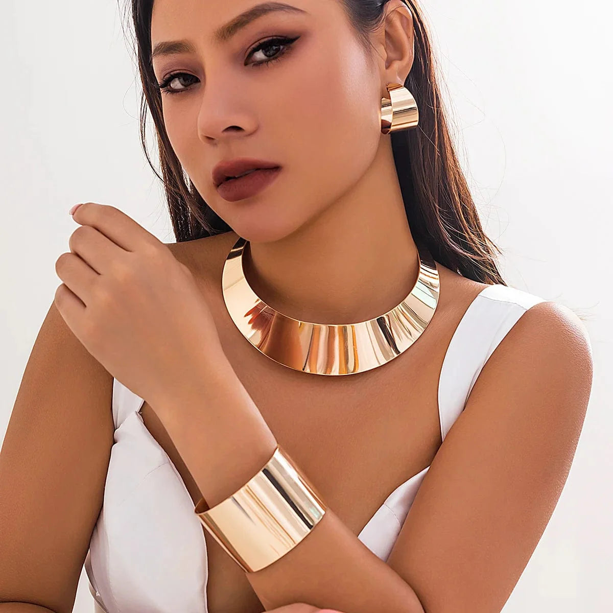 Showlu Fashion African collar jewelry set with wide smooth metal necklace, matching earrings, and bracelet for women.