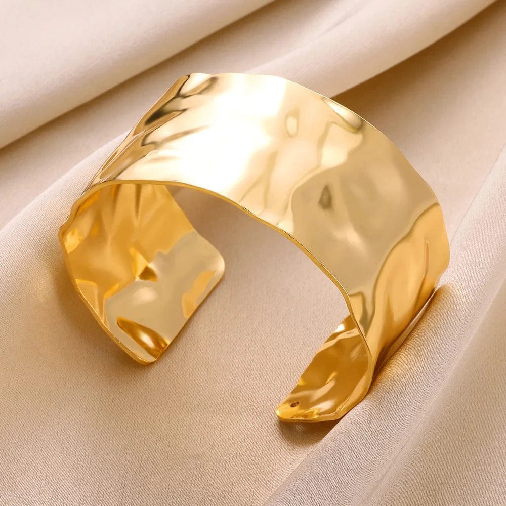 Gold stainless steel cuff bracelet with bump pattern, open design, stylish women's jewelry, perfect as a gift or hand accessory.