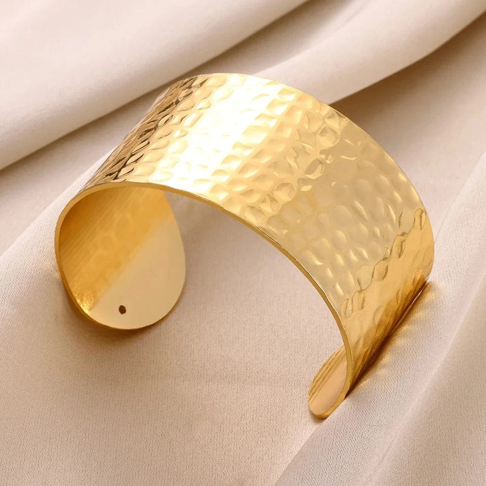 Gold stainless steel cuff bracelet with bump pattern for women, stylish open bangle jewelry, perfect as a gift.