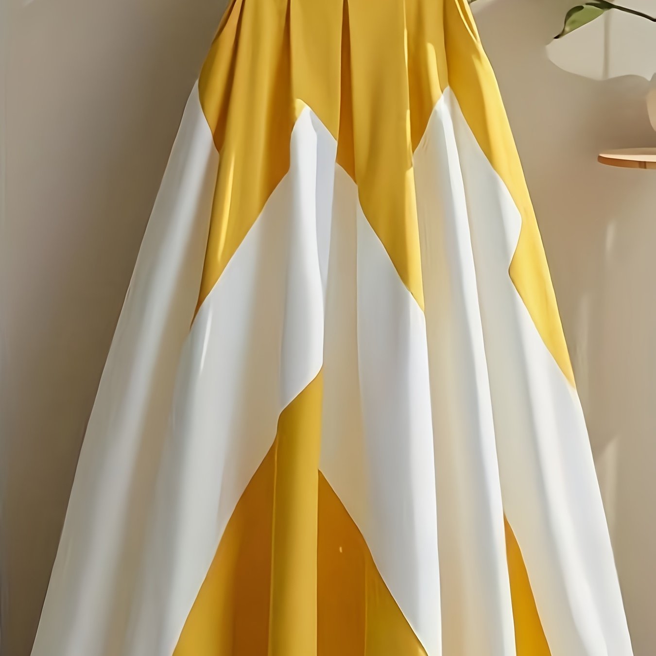Yellow and white striped high-waist A-line polyester skirt from SHOWLU FASHION, showcased on a model.
