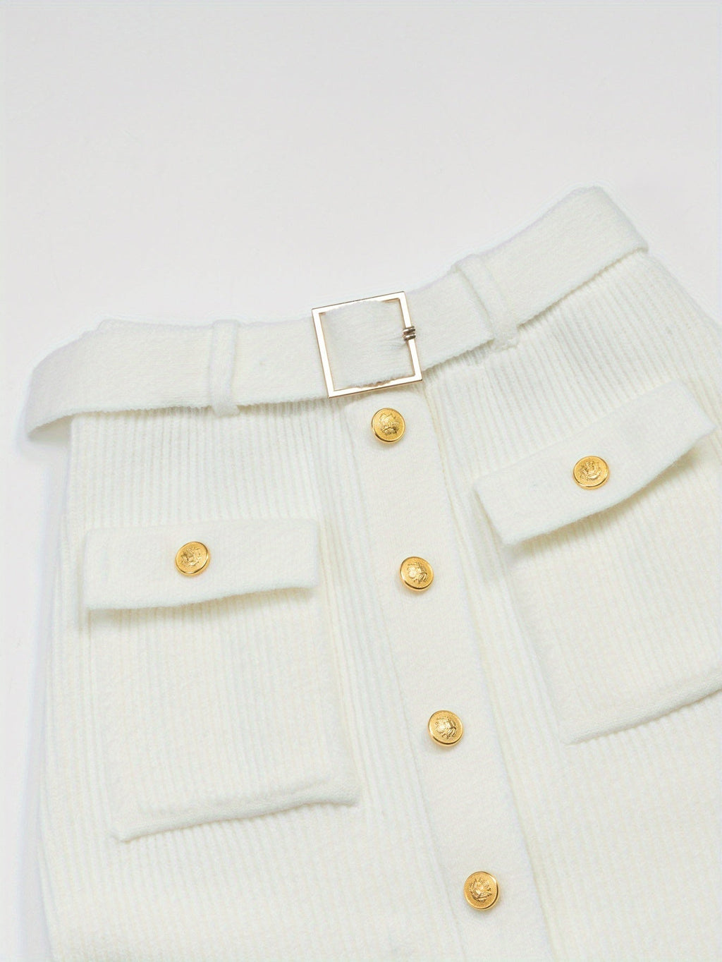 White midi skirt by SHOWLU FASHION STORE featuring high-waisted, knit design with elegant, flowing silhouette.