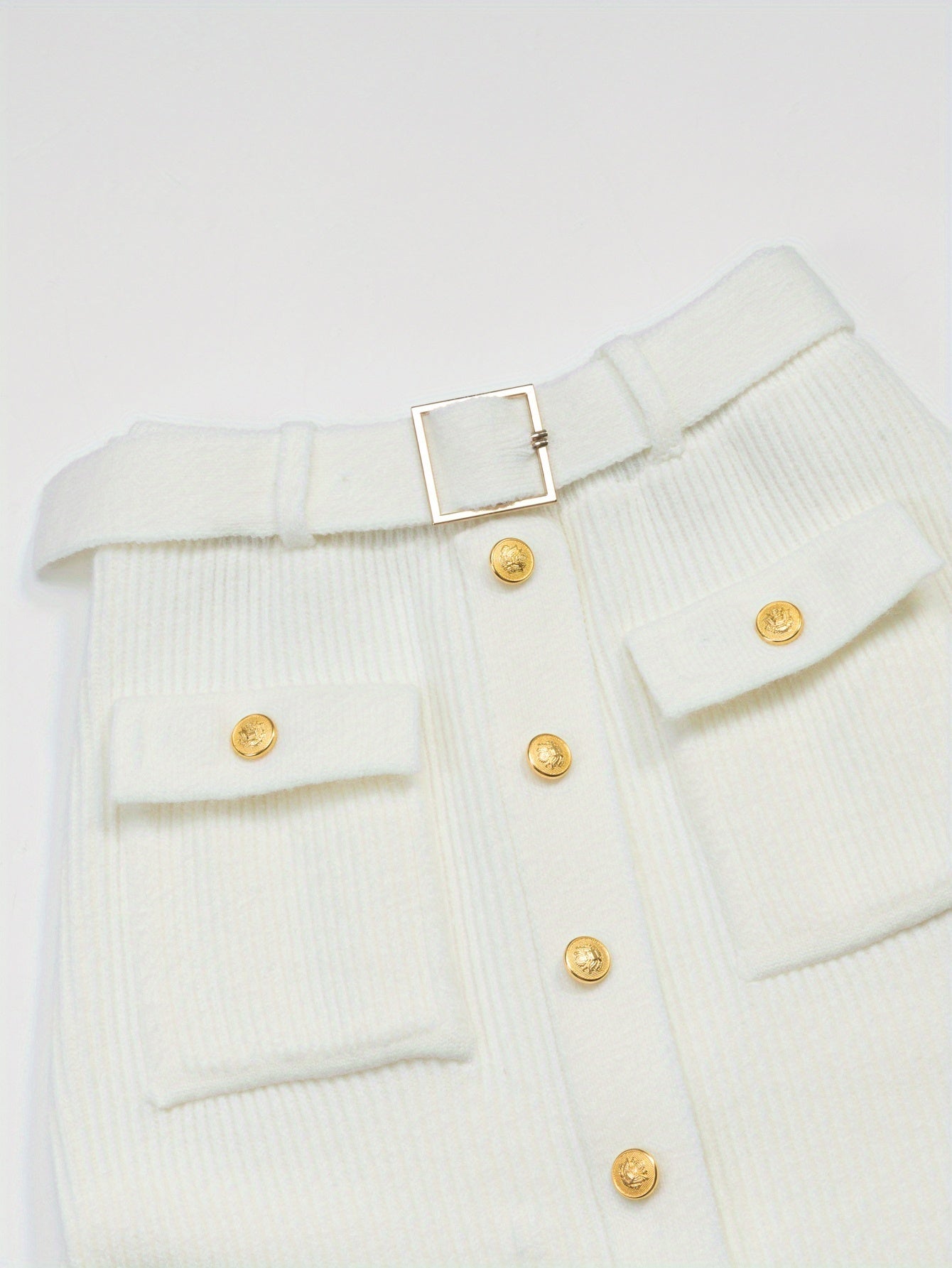 White midi skirt by SHOWLU FASHION STORE featuring high-waisted, knit design with elegant, flowing silhouette.