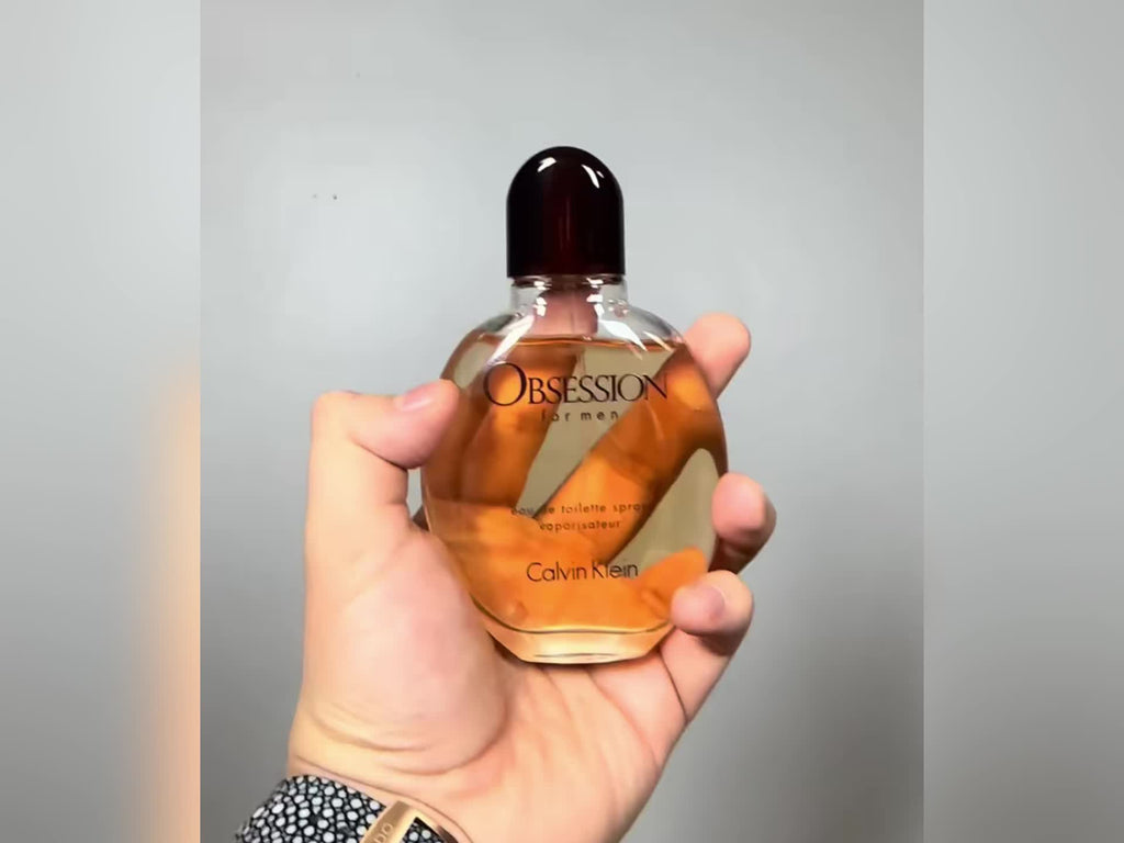 Calvin Klein Obsession for Men Oriental Woody EDT cologne spray, featuring sleek bottle design and rich, warm fragrance.