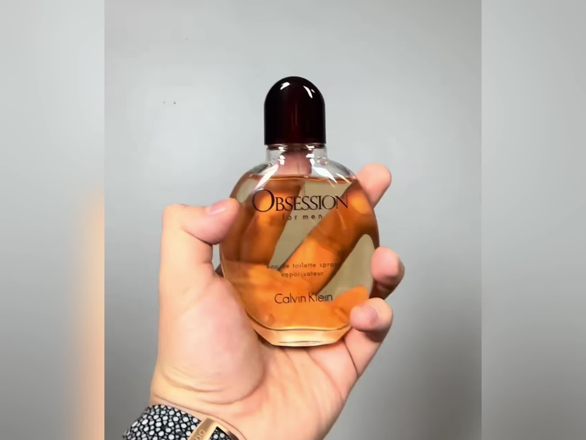 Calvin Klein Obsession for Men Oriental Woody EDT cologne spray, featuring sleek bottle design and rich, warm fragrance.