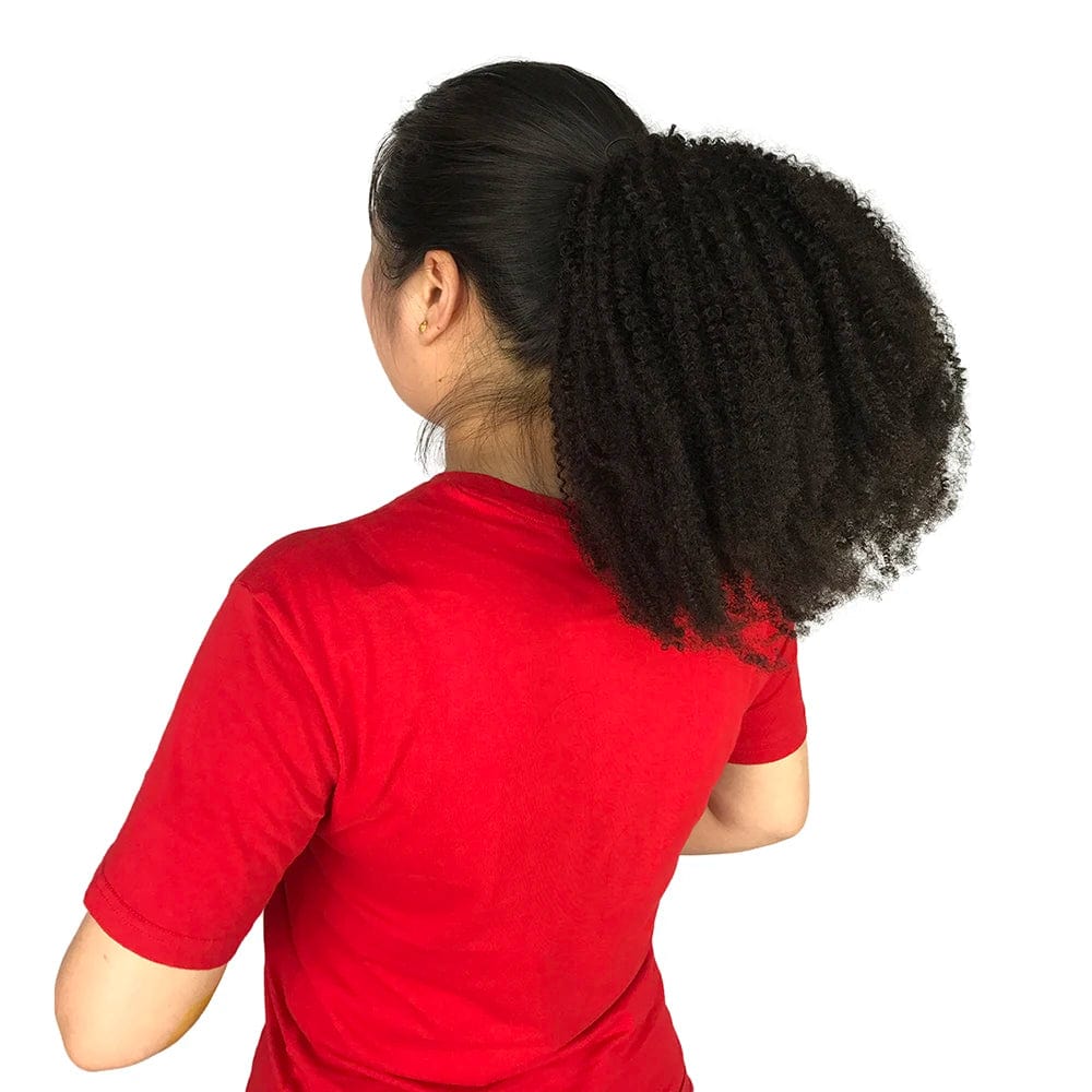 Showlu Malaysian Afro Kinky Ponytail extension for women, black 100% human hair, styled in a sleek ponytail with natural texture.