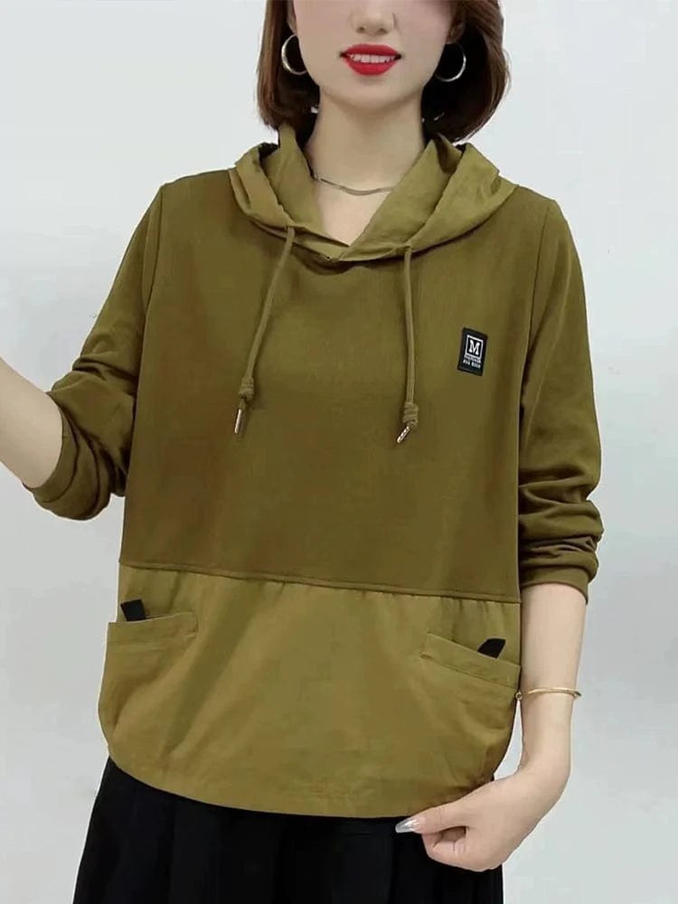 Women’s loose pullover hoodie by Showlu Fashion in a solid color, perfect for casual autumn wear.