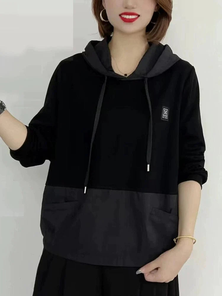 Loose women's pullover hoodie in a solid color, casual autumn top by Showlu Fashion, perfect for comfortable fall outfits.