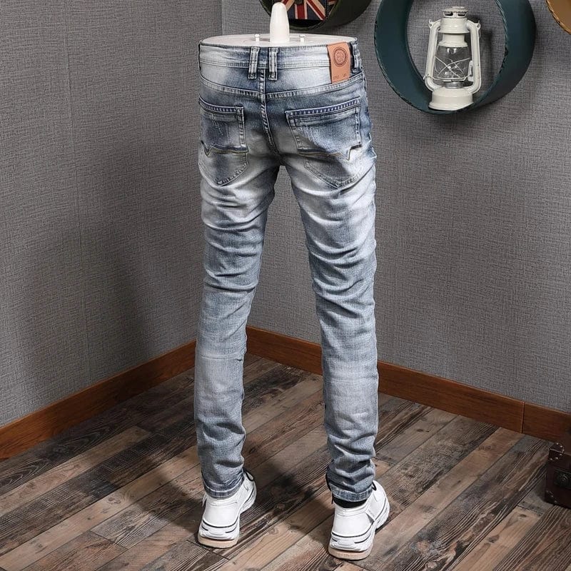 Light blue retro slim fit ripped denim jeans for men, featuring stretch fabric and vintage casual style by Showlu Fashion Store
