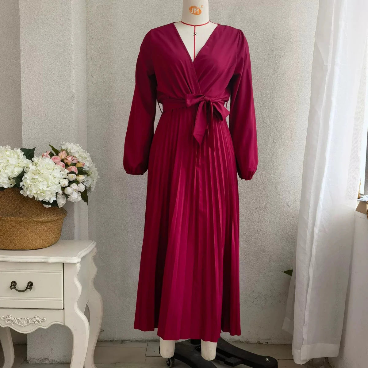 Elegant SHOWLU FASHION women's V-neck pleated maxi dress with long sleeves and A-line silhouette, featuring a flowing, stylish design.