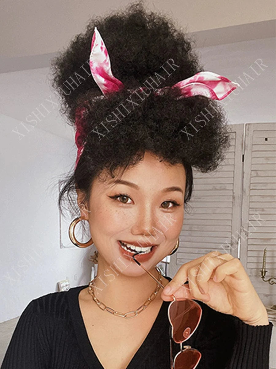 SHOWLU Afro Kinky Curly Hair Bun synthetic small roll wig piece, styled for a natural, textured afro look on a model.